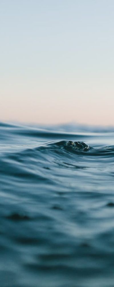 body of water under blue and white skies 1533720